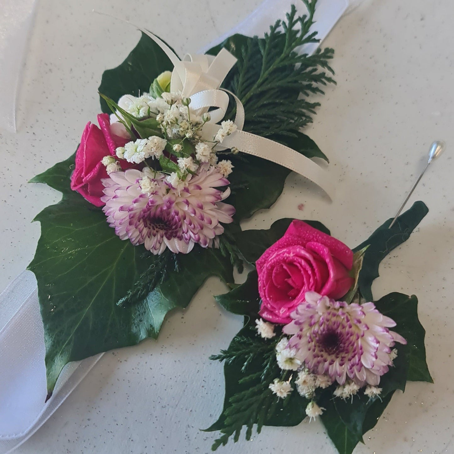 Floral corsage with pink and white flowers
